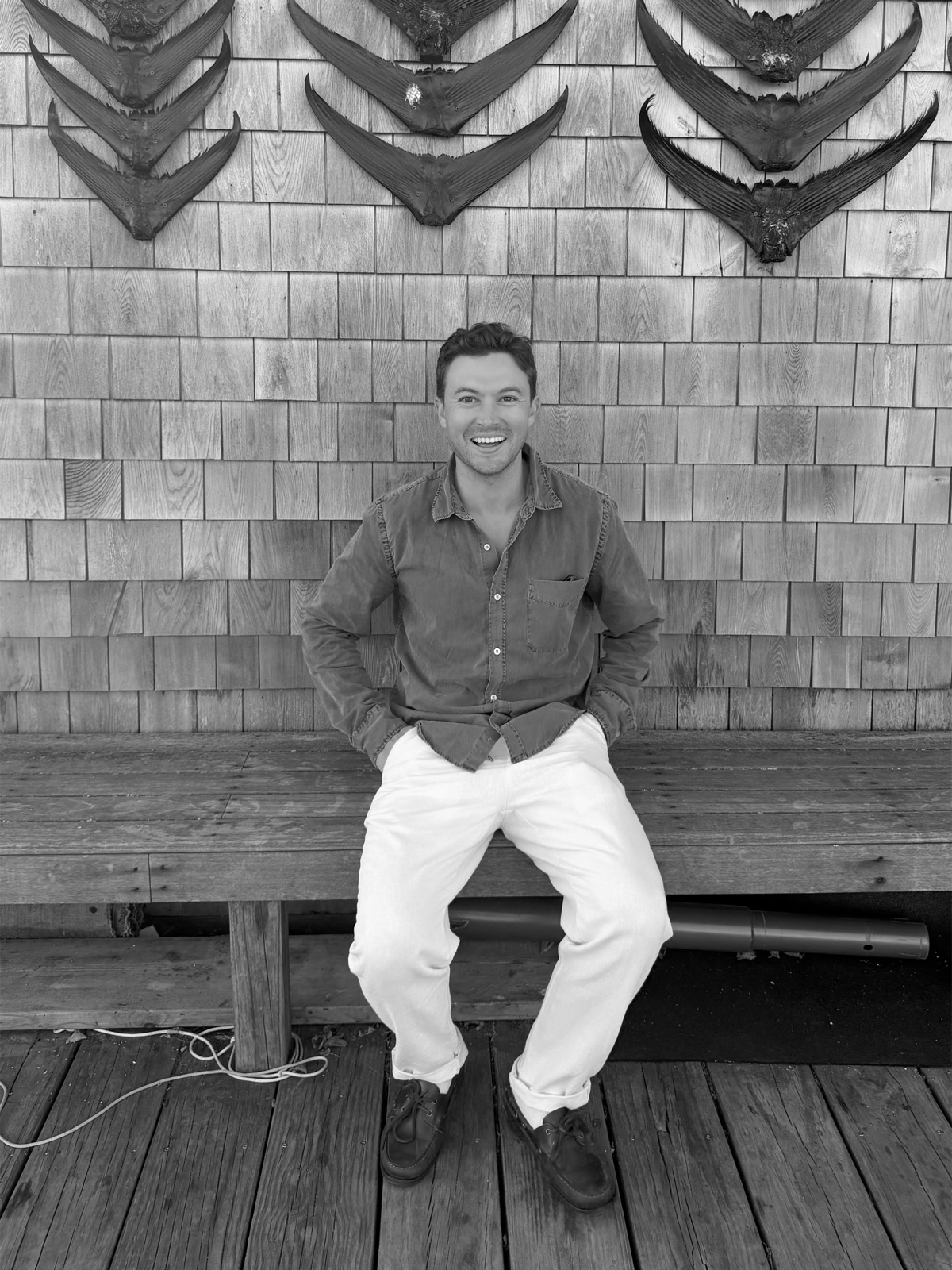 Paxton Sedler seated on a bench in Nantucket, Massachusetts